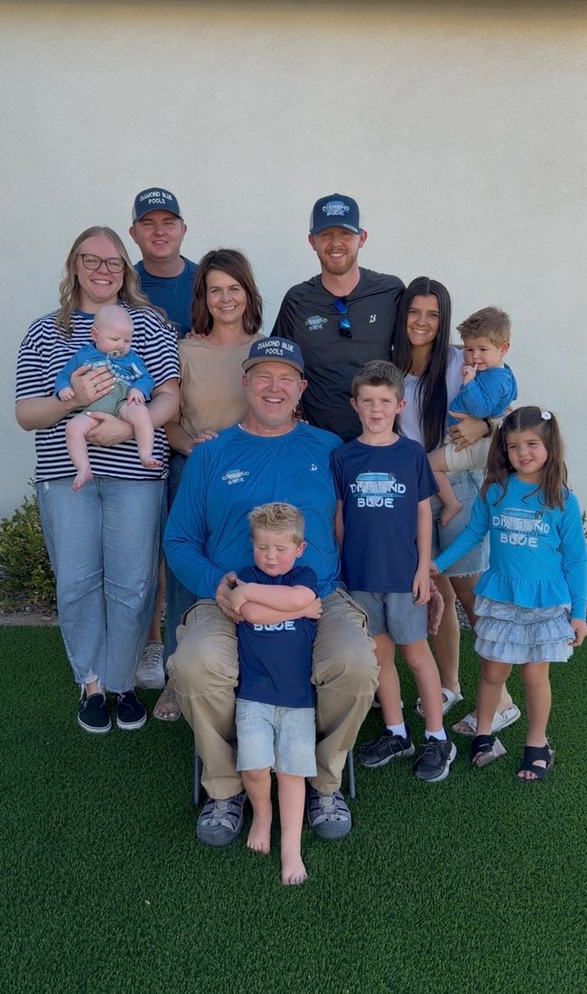 The Diamond Blue Pool Service family in Queen Creek, AZ, wearing branded shirts